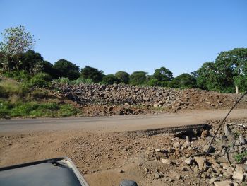 Road by Lake Manyara National Park entrance showing previous small stream bed
